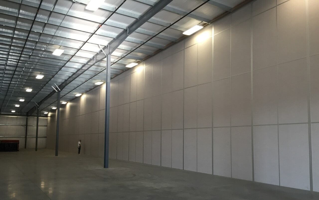 An industrial warehouse needed a wall solution that could endure heavy impacts and exposure to chemicals